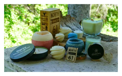 photo of a variety of candles and wood carvings