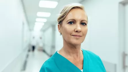 Woman healthcare worker in hallway