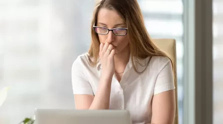 anxious looking woman at a laptop