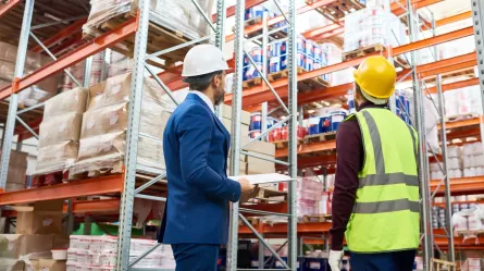 employer at warehouse with employee