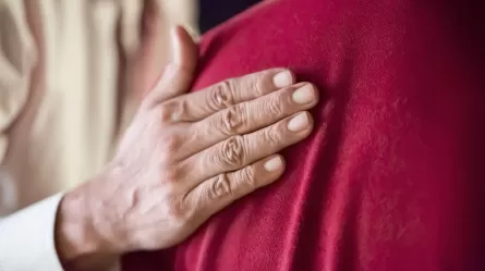 caring hand on shoulder, close up