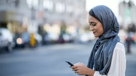 Young woman crossing street