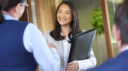 young woman shaking hands with supervisor of internship