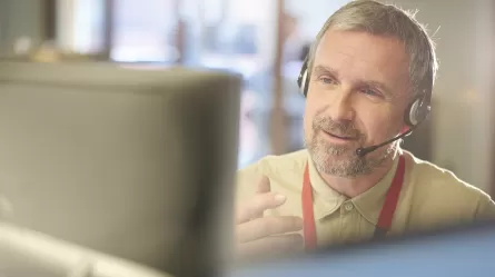 mature CareerForce specialist on the phone helping a caller