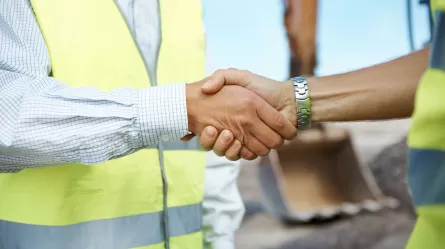 construction workers shaking hands