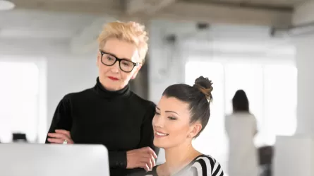 older woman mentoring younger woman