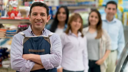 employer with store employees in the background