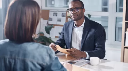 manager in meeting with employee