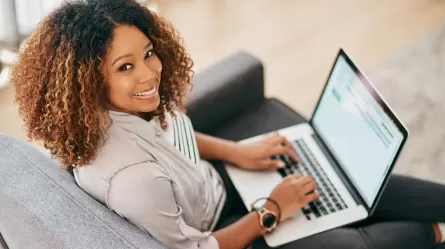 young woman working on laptop at home