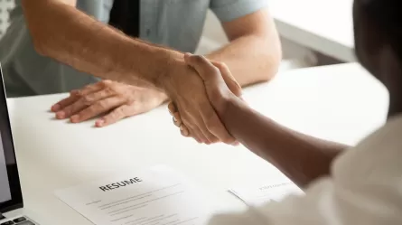 employer and employee shaking hands