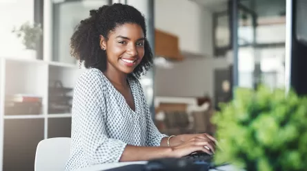 young woman working at desk in office