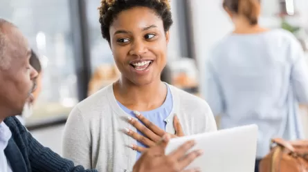 young woman working on resume with a specialist
