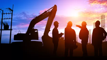 construction workers at sunset