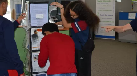 photo of teens engaged in an escape room activity where they unlock keys by doing career exploration