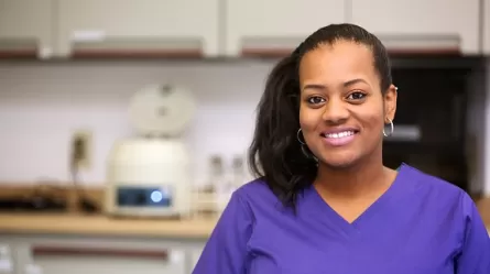 picture of woman in scrubs in health care setting