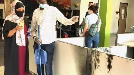 Hamse Warfa joins others in cleaning up CareerForce Minneapolis - South after vandalism and fire