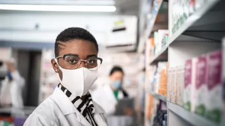 Pharmacy worker wearing a mask