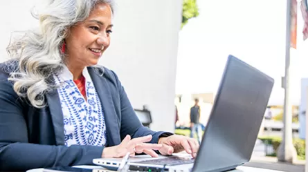 Latino woman on laptop
