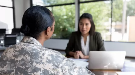 woman veteran in uniform with career counselor