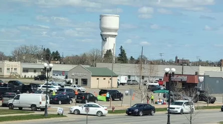 photo of cars lined up for Brainerd drive through career fair April 2021