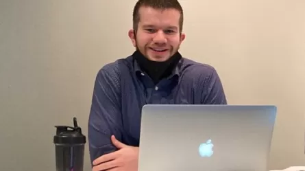 photo of Hans who went from working low wage service jobs to a stable career track position in IT