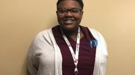 photo of Tiona who moved from food service jobs to a health care career thanks to Dislocated Worker