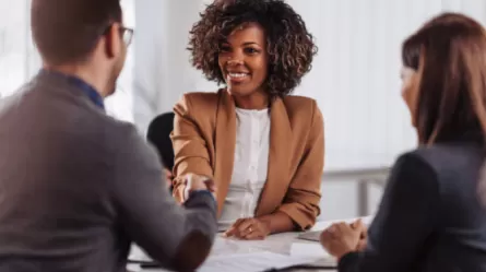 employer and others in business meeting