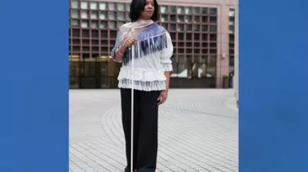 Michele Denise Michaels with white cane