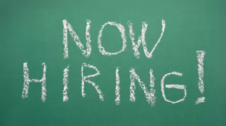 Now Hiring! written on chalkboard