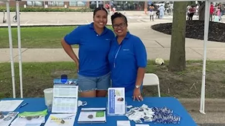 two CareerForce staff members at table with resources
