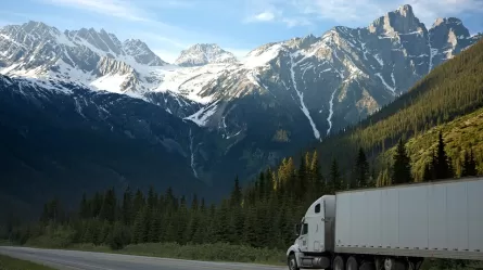 semi truck driving on mountain highway