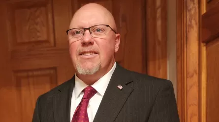 photo of a smiling man in a business suit