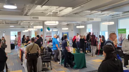 Crowds of people at Veterans & Community Job Fair held 9-27-23 at CareerForce Minneapolis North