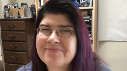 smiling woman wearing glasses