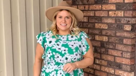 photo of smiling person wearing a hat