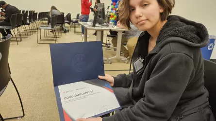 photo of person holding a certificate