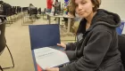 photo of person holding a certificate
