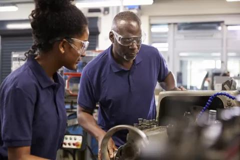 Manufacturing worker learning equipment