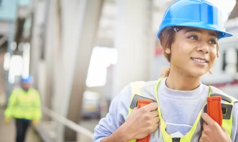 woman in hardhat on construction site