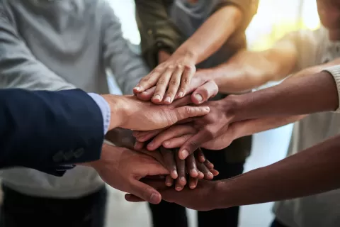 many hands together