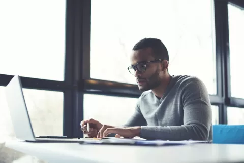 young man working at a laptop