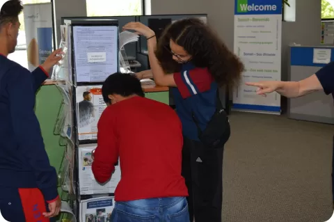photo of teens engaged in an escape room activity where they unlock keys by doing career exploration