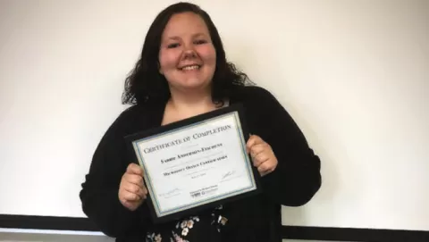 photo of Sabrie with certificate she earned