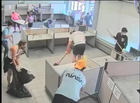 volunteers clean up CareerForce Minneapolis South after vandalism and fire early on 5-30-20