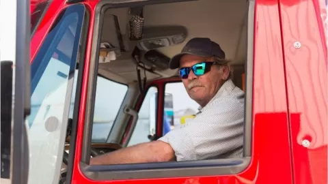 man driving a large truck