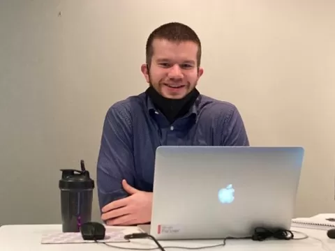 photo of Hans who went from working low wage service jobs to a stable career track position in IT