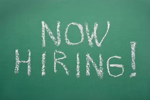 Now Hiring! written on chalkboard