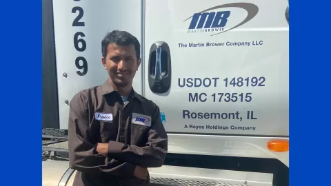 Krishna in front of the heavy truck he drives