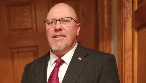 photo of a smiling man in a business suit