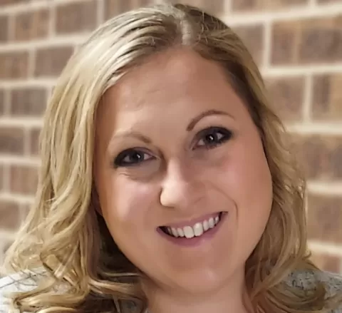 smiling woman with blond hair